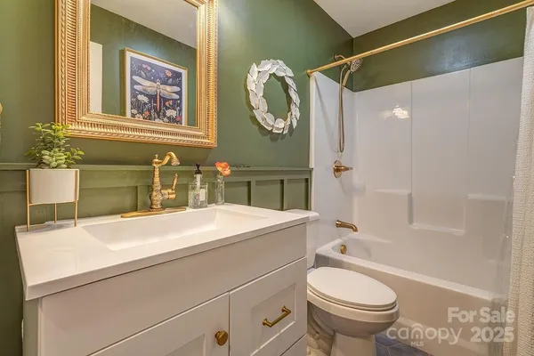 a bathroom with a sink a toilet and a bathtub