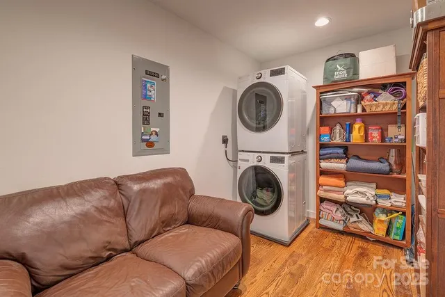 a living room with furniture a washer and dryer