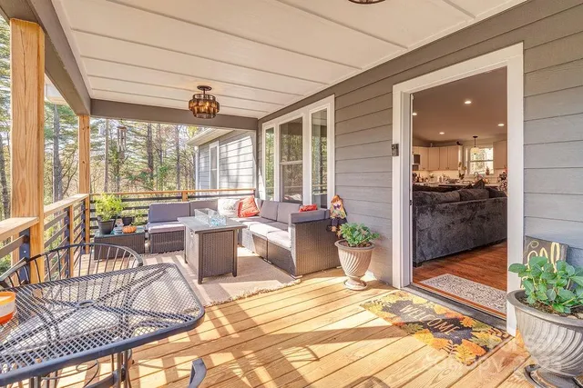 a view of a patio with a dining table and chairs