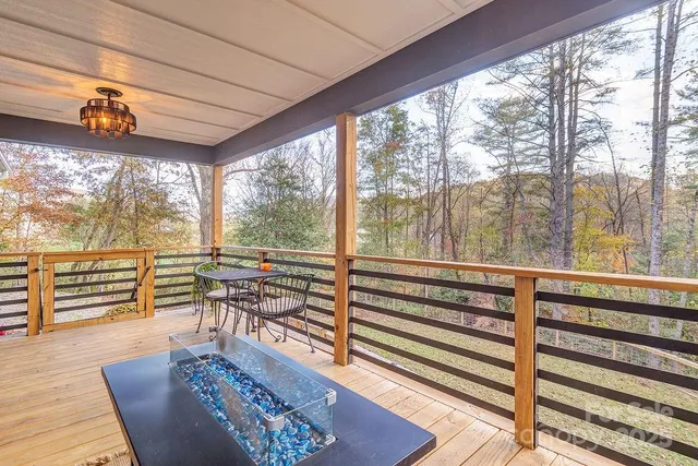 a view of a room with wooden floor and furniture