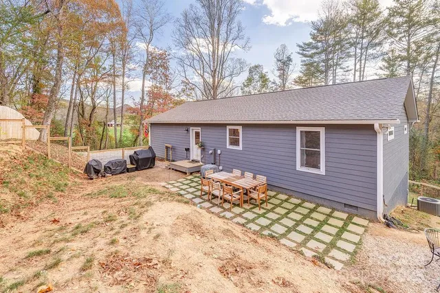 a view of a house with a bed and chair
