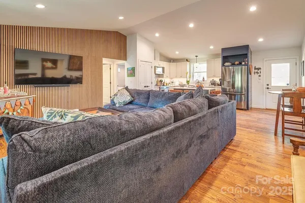 a living room with furniture and a flat screen tv