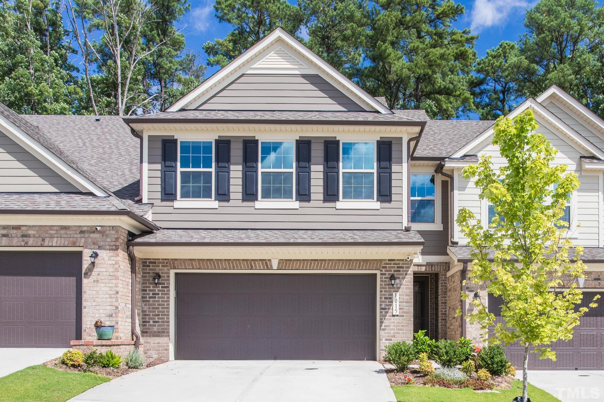 1015 Catch Fly Lane Durham, NC 27713 - Photo 1 of 18 a front view of a house with a garden