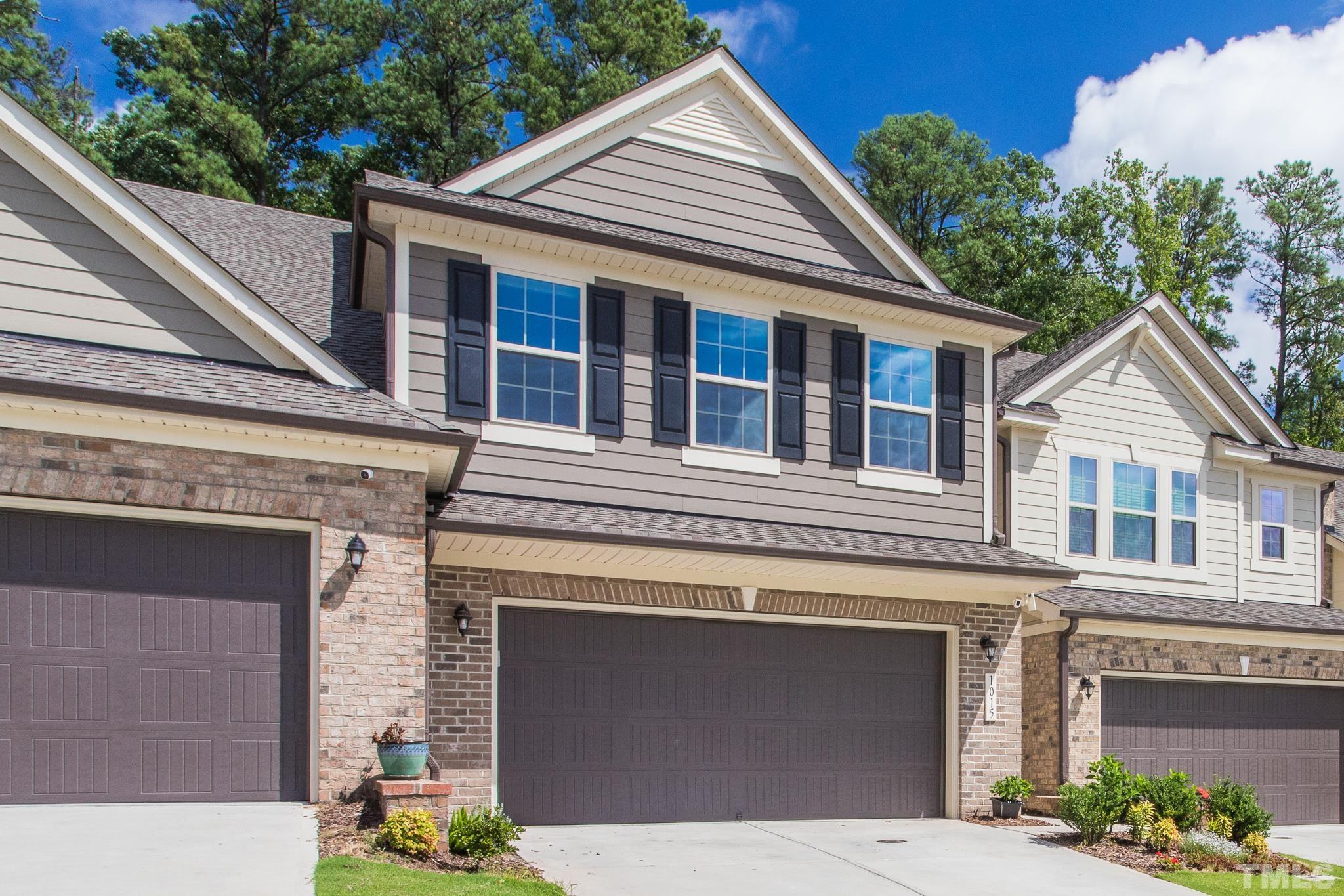 1015 Catch Fly Lane Durham, NC 27713 - Photo 2 of 18 a view of a house with a yard and potted plants