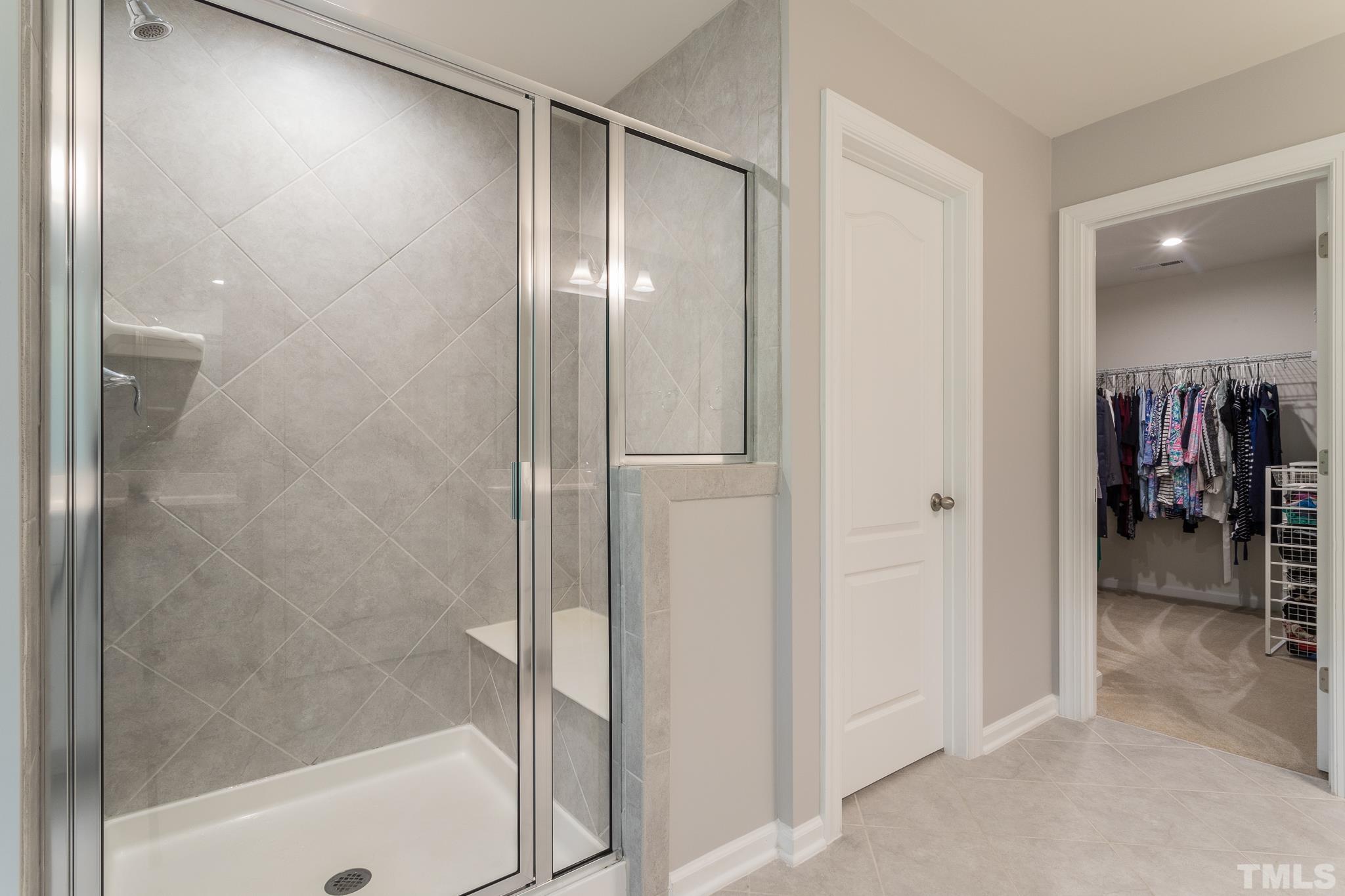 1015 Catch Fly Lane Durham, NC 27713 - Photo 11 of 18 a bathroom with a glass shower door