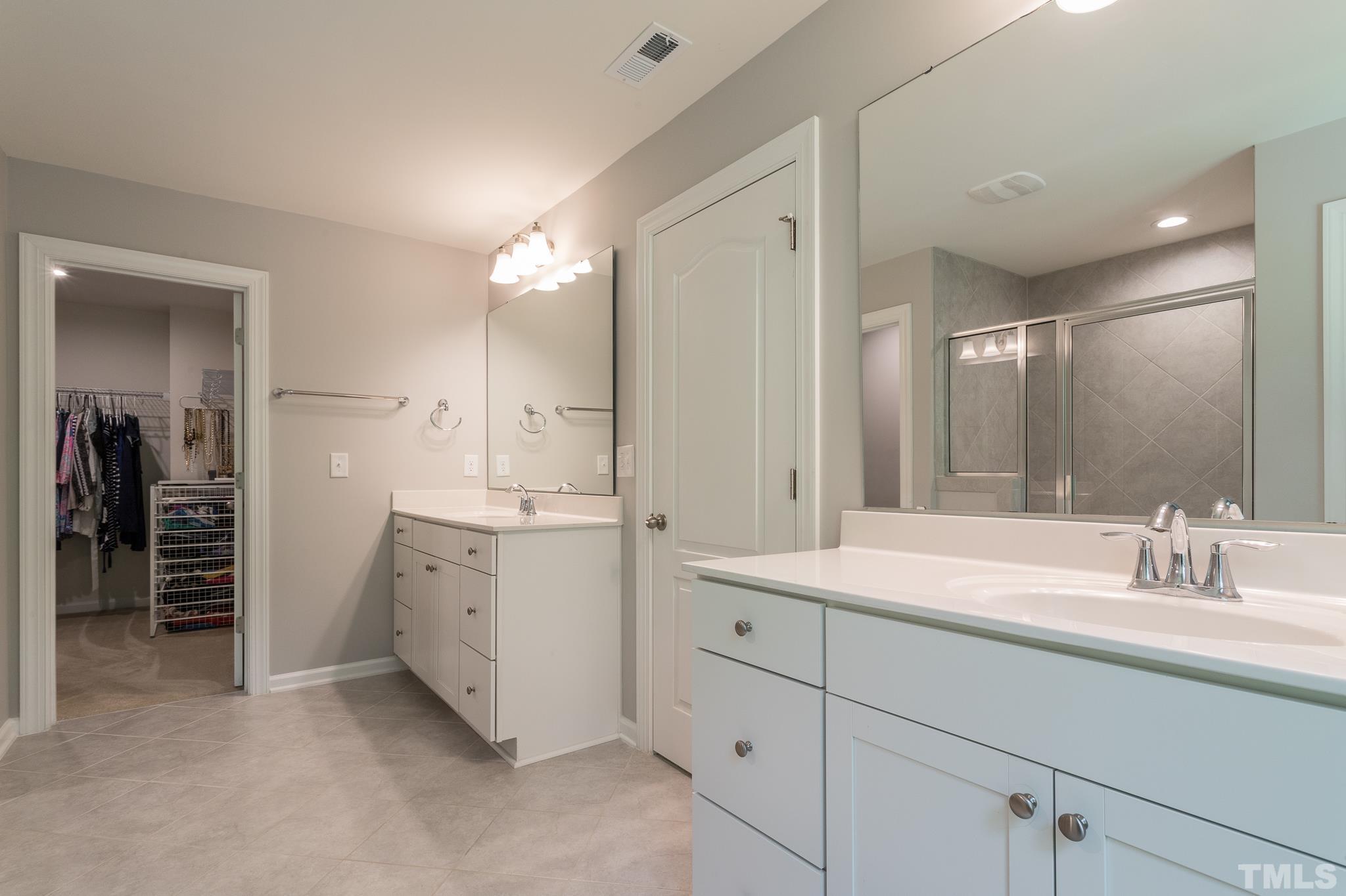 1015 Catch Fly Lane Durham, NC 27713 - Photo 12 of 18 a bathroom with a double vanity sink mirror and double
