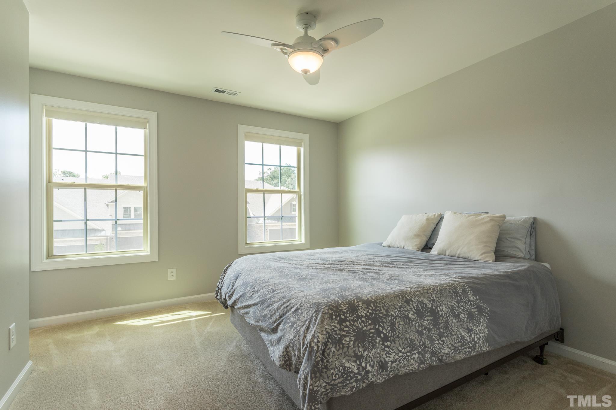 1015 Catch Fly Lane Durham, NC 27713 - Photo 13 of 18 a bedroom with a bed and window