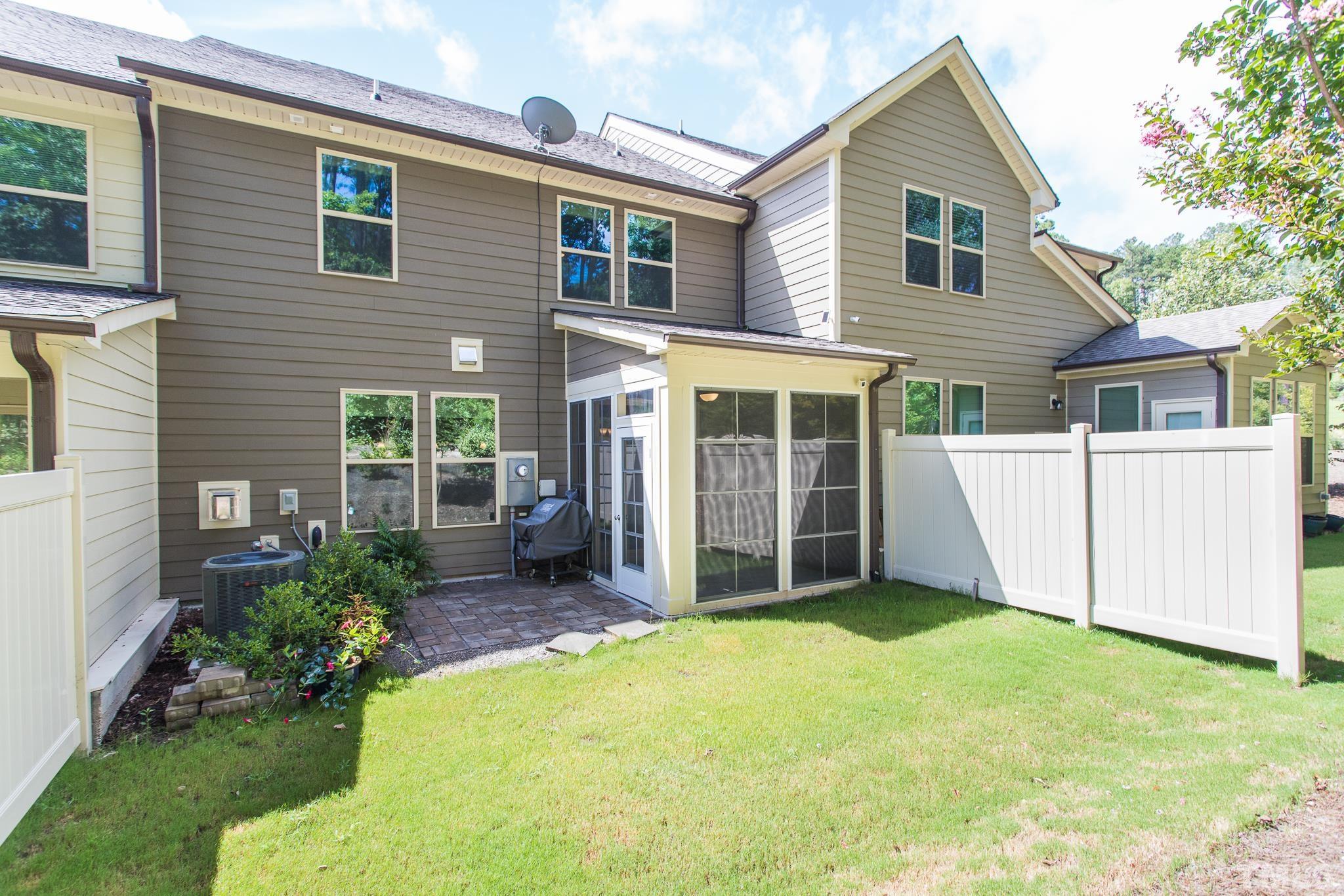 1015 Catch Fly Lane Durham, NC 27713 - Photo 18 of 18 a view of a house with a yard and porch