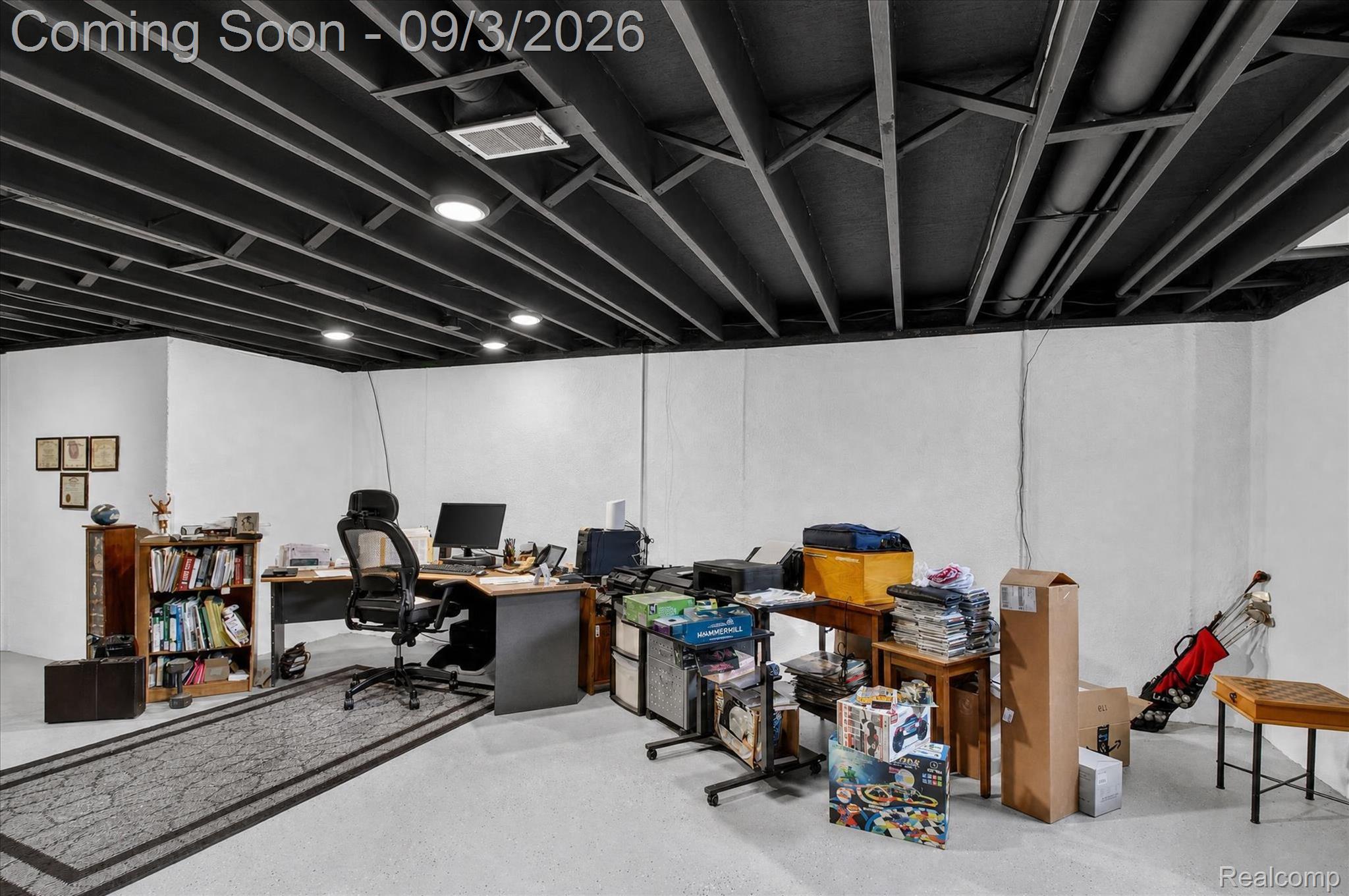 27260 Campbell Road Warren, MI 48093 - Photo 35 of 60 White walls, exposed black ceiling beams, recessed lighting, and light-toned flooring
