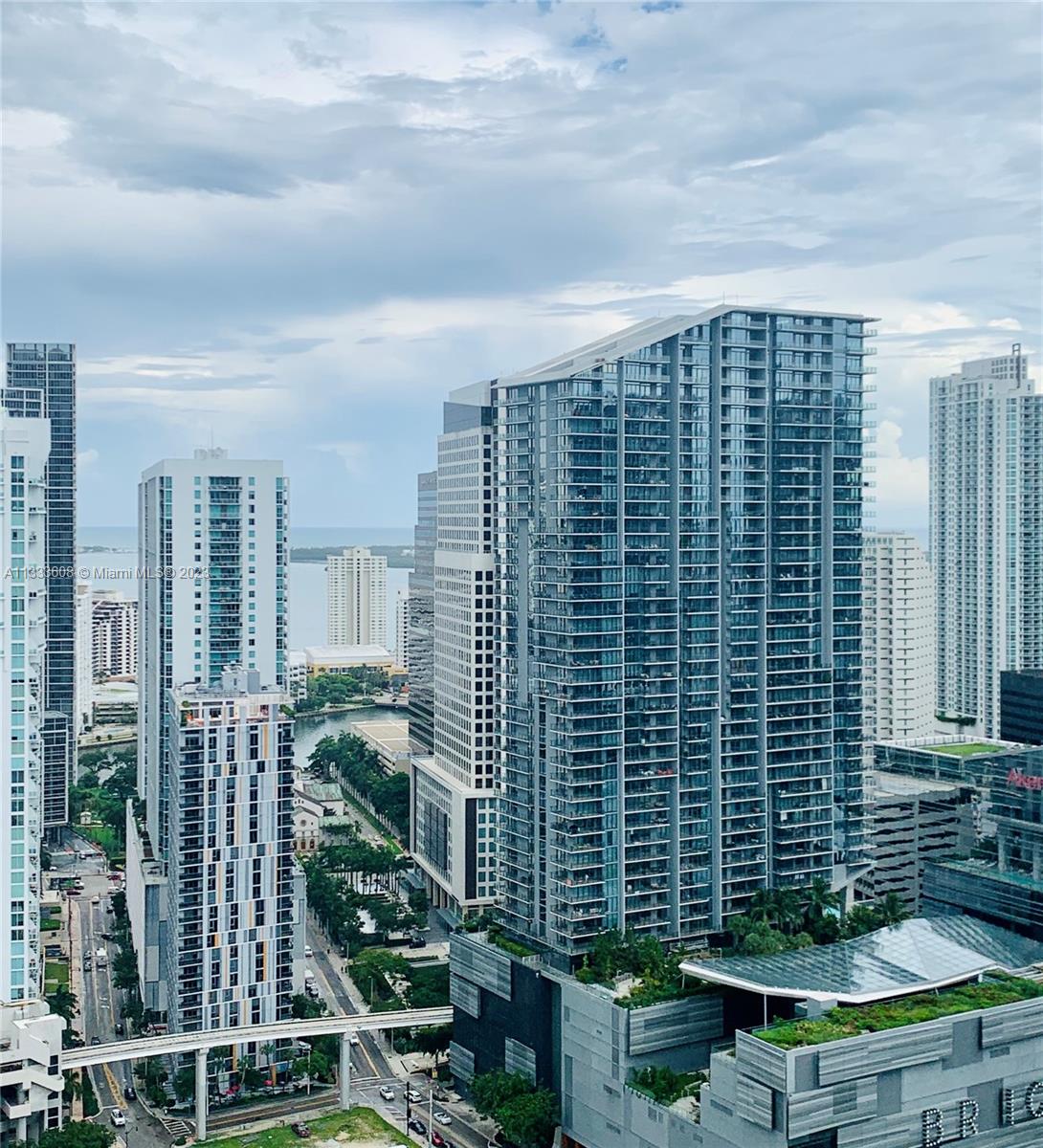 92 Southwest 3rd Street, Unit 4111 Miami, FL 33130 - Photo 20 of 24 a backyard of a house with outdoor seating