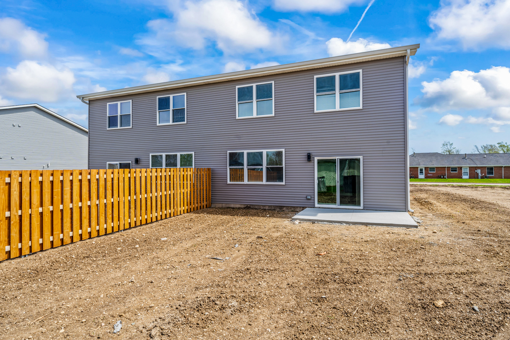 1318 8th Street, Unit 1318 Harvard, IL 60033 - Photo 11 of 19 a front view of a house with a yard