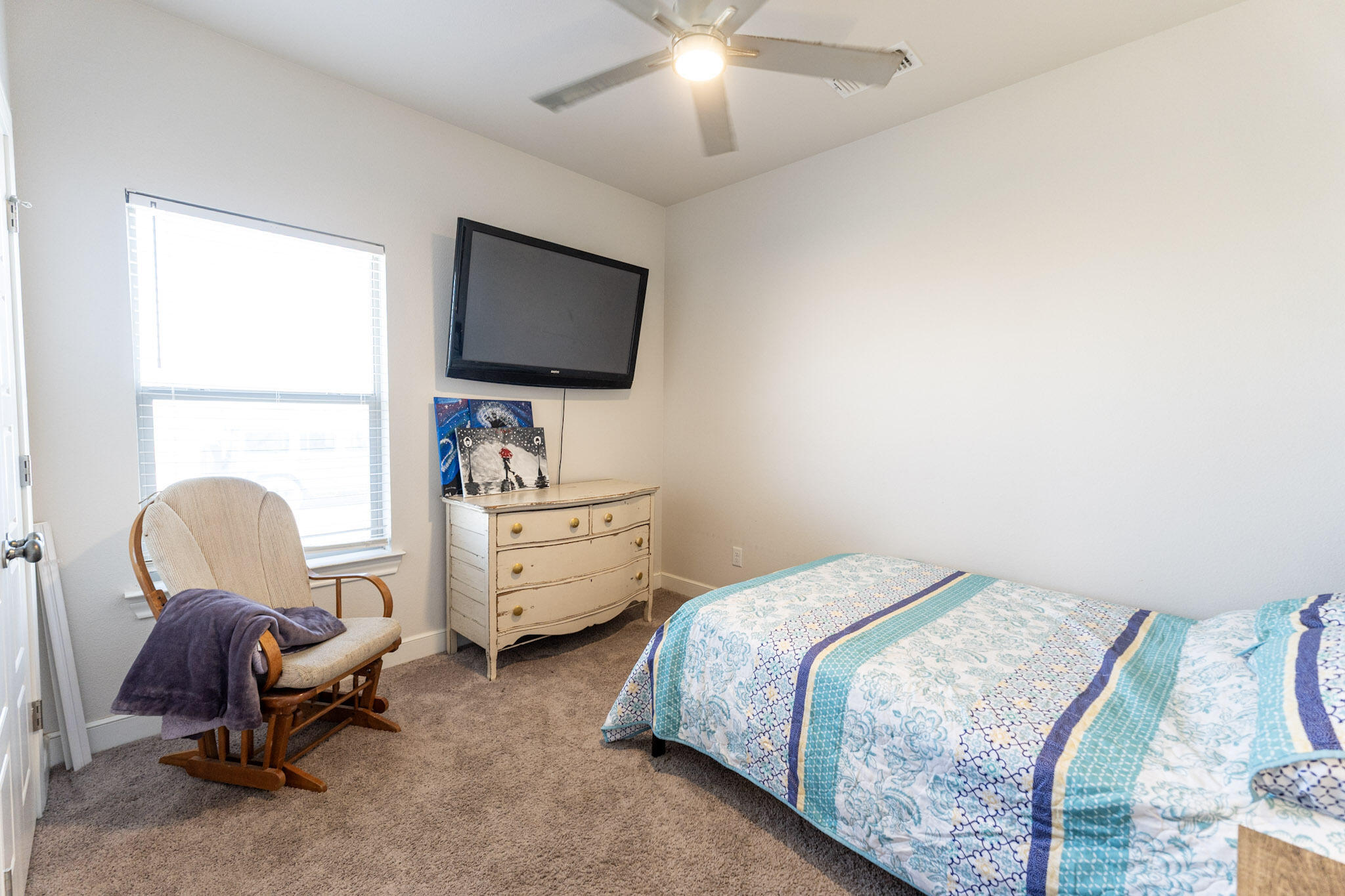 6801 51st Street Lubbock, TX 79407 - Photo 12 of 19 a bedroom with a bed and a flat screen tv