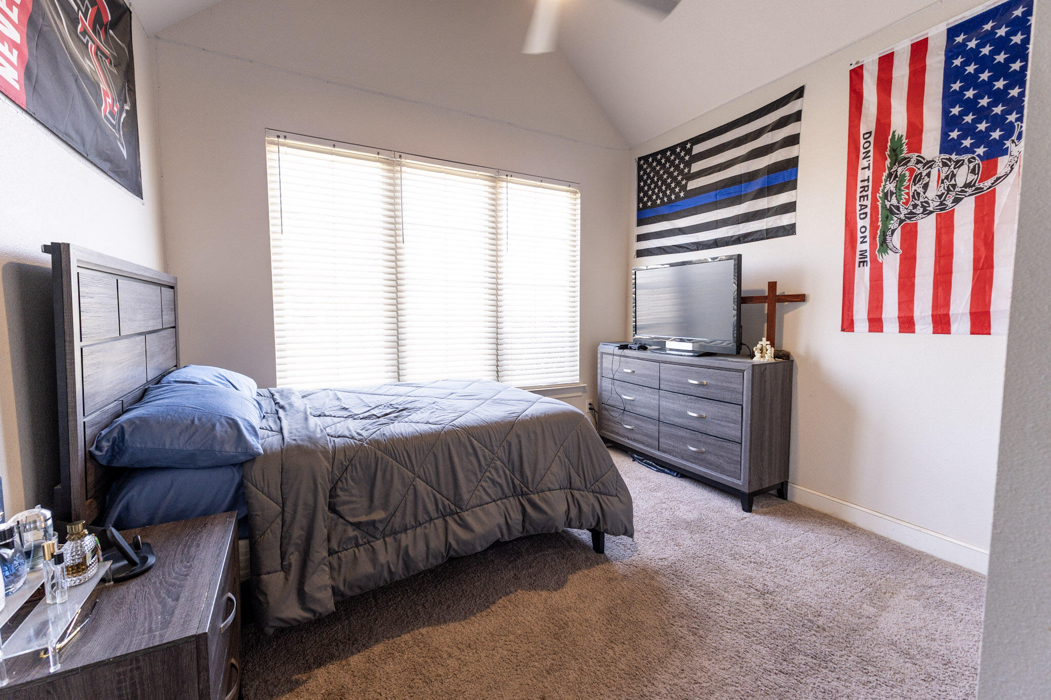 6801 51st Street Lubbock, TX 79407 - Photo 14 of 19 a bedroom with a bed dresser and a window