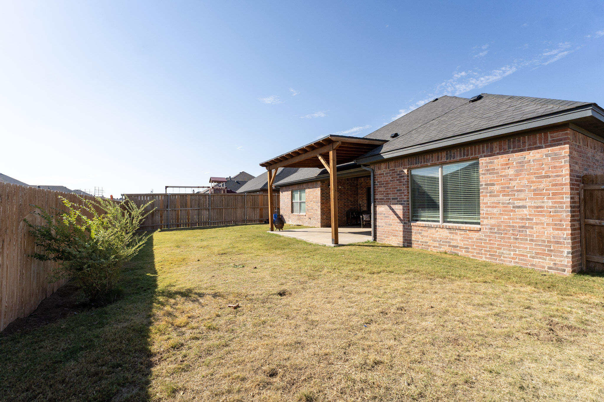 6801 51st Street Lubbock, TX 79407 - Photo 19 of 19 a front view of a house with a yard