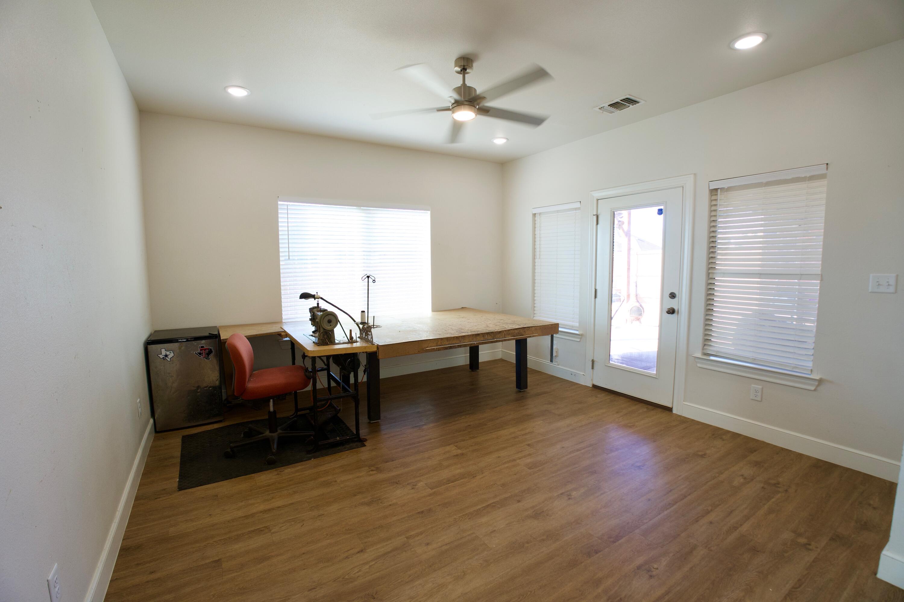 6801 51st Street Lubbock, TX 79407 - Photo 8 of 19 a living room with furniture and a wooden floor