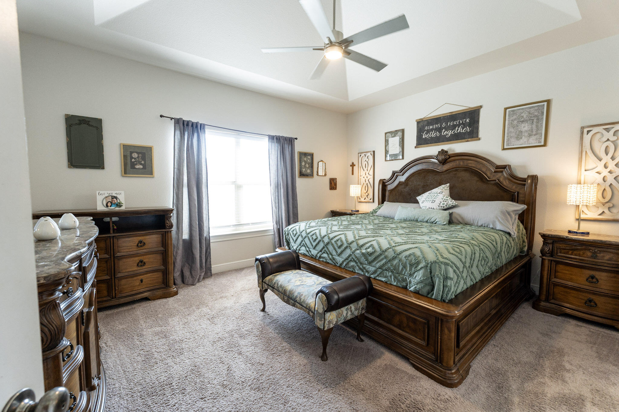 6801 51st Street Lubbock, TX 79407 - Photo 9 of 19 a bedroom with a bed and a flat tv screen on the dresser