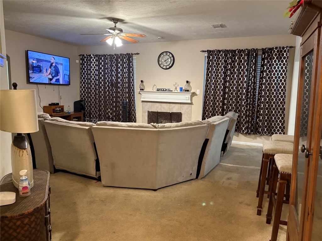 13801 Stark Bridge Lane Rosharon, TX 77583 - Photo 5 of 17 a living room with furniture a window and a fireplace