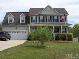 127 Saddle Ridge Drive Willow Spring, NC 27592 - Photo 2 of 10 a front view of a house with a yard