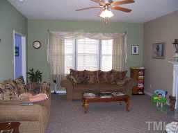 127 Saddle Ridge Drive Willow Spring, NC 27592 - Photo 3 of 10 a living room with furniture and a large window