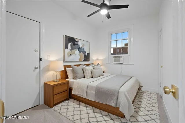 a bedroom with bed and window