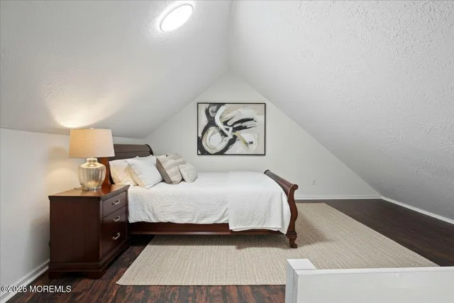 a view of an empty room and wooden floor