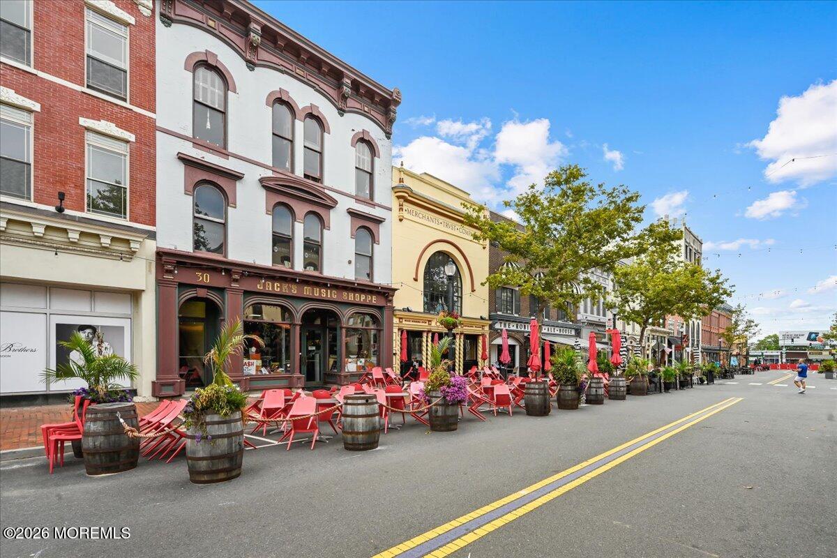 17 Leroy Place, Unit 3B Red Bank, NJ 07701 - Photo 26 of 38 a group of people sitting in front of a building
