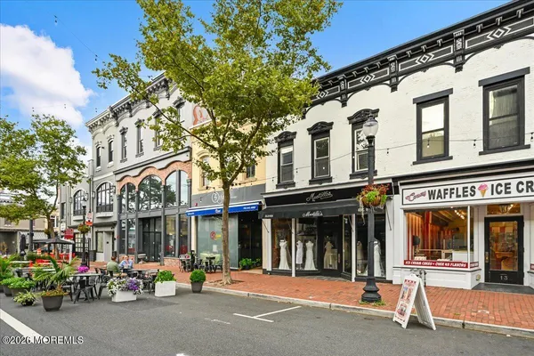 a view of a cafe with a table and chairs
