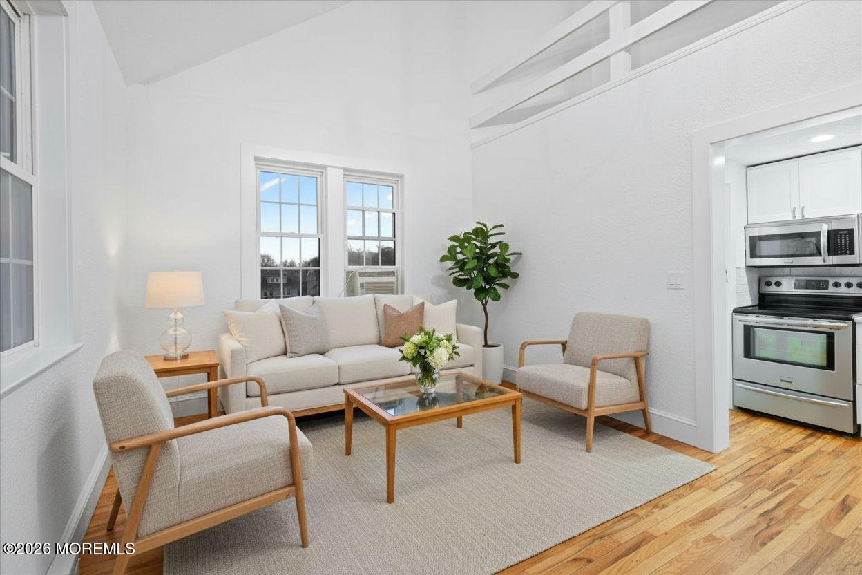 17 Leroy Place, Unit 3B Red Bank, NJ 07701 - Photo 9 of 38 a living room with furniture and wooden floor