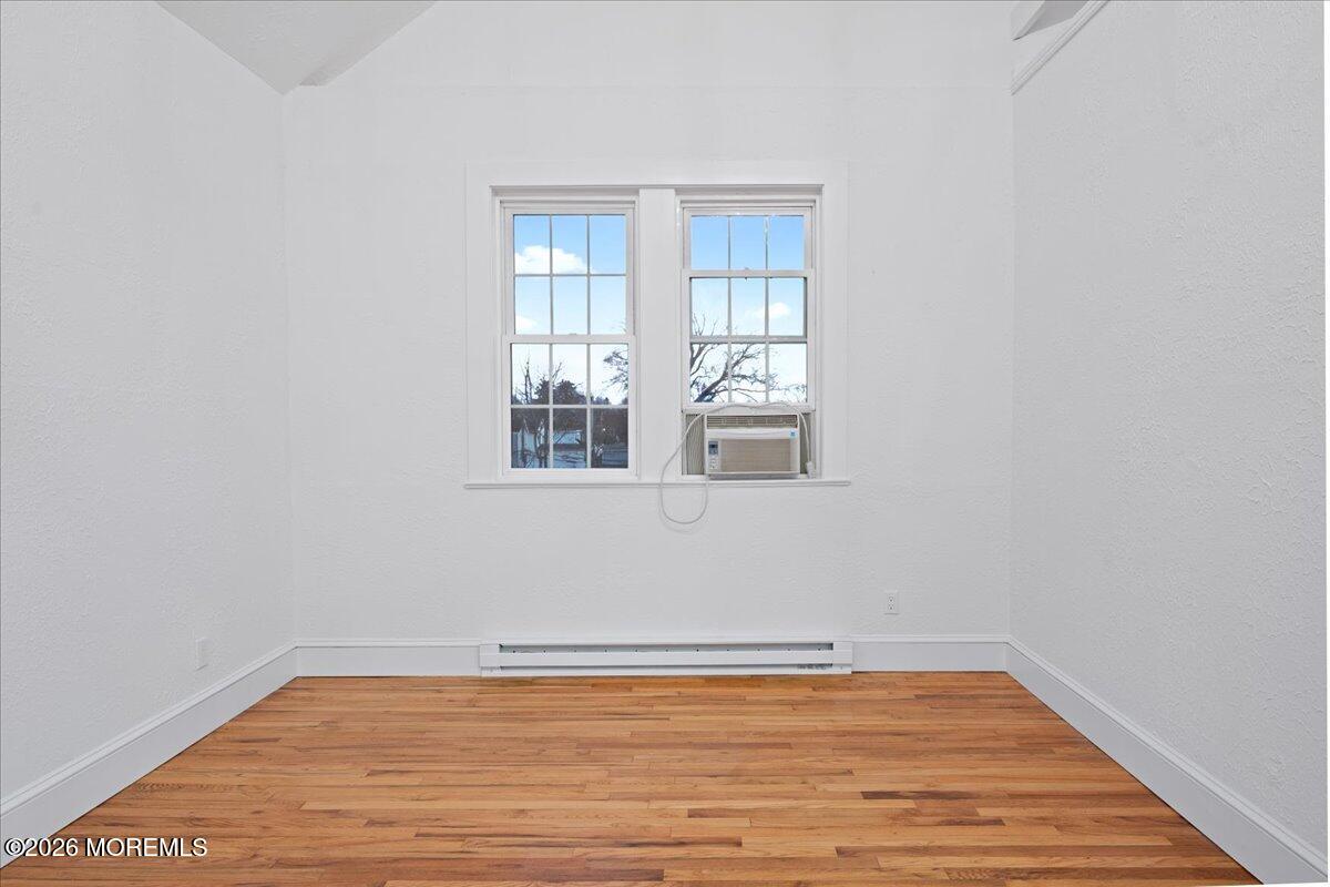 17 Leroy Place, Unit 3B Red Bank, NJ 07701 - Photo 10 of 38 a view of a room with wooden floor and windows