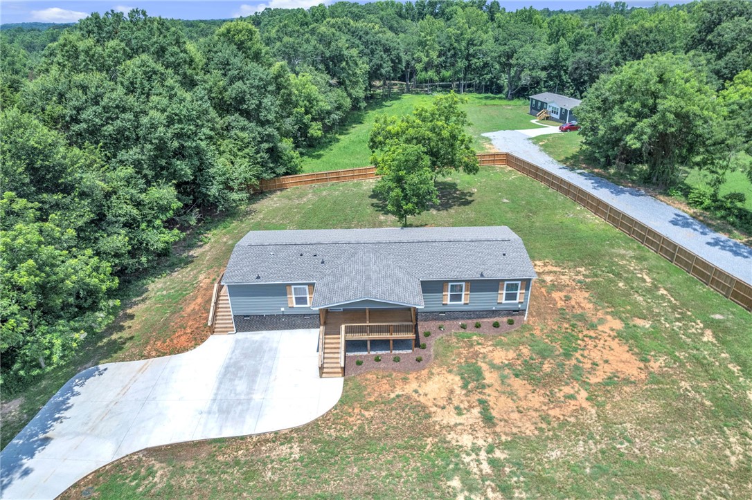 108 Old River Road Iva, SC 29655 - Photo 28 of 31 Perched on a verdant lot, this new construction home offers a long driveway and natural tree-lined privacy.