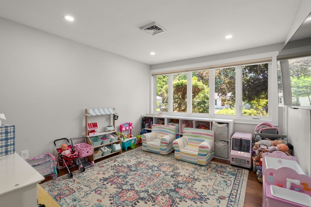 10 Brookdale Road Natick, MA 01760 - Photo 15 of 19 a living room with furniture and a large window