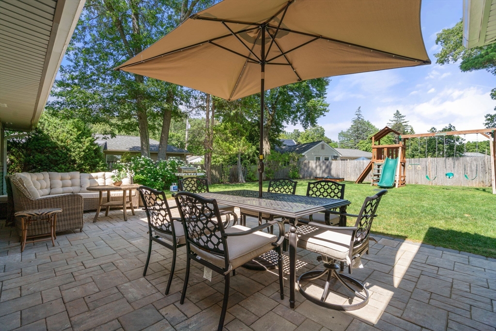 10 Brookdale Road Natick, MA 01760 - Photo 16 of 19 an outdoor space with furniture and umbrella