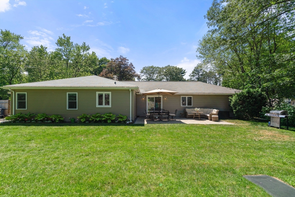 10 Brookdale Road Natick, MA 01760 - Photo 19 of 19 a view of a house with a yard and sitting area