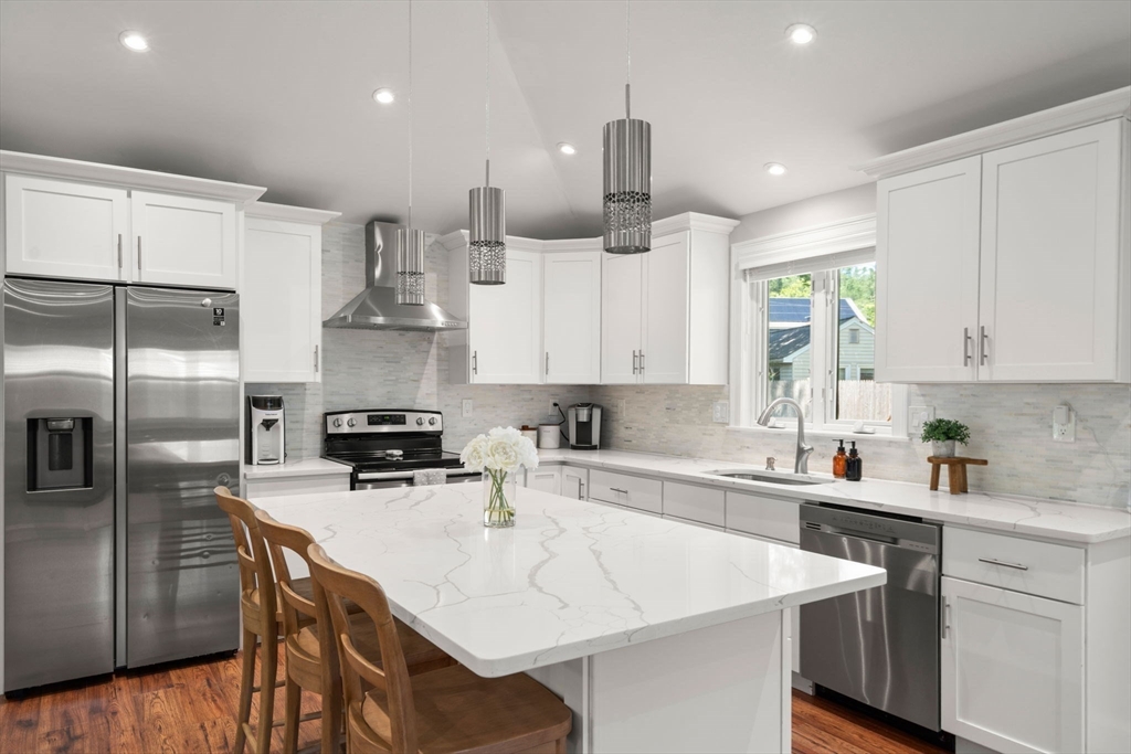 10 Brookdale Road Natick, MA 01760 - Photo 5 of 19 a kitchen with a sink a counter space appliances and cabinets