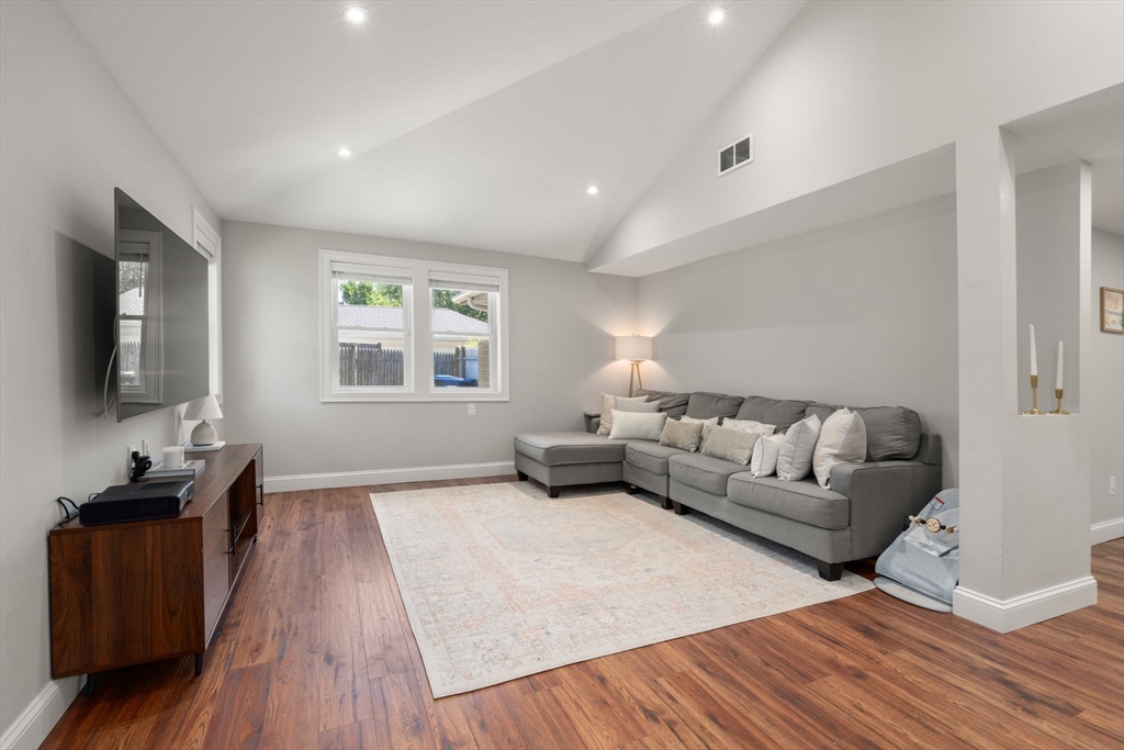 10 Brookdale Road Natick, MA 01760 - Photo 8 of 19 a living room with furniture and a flat screen tv