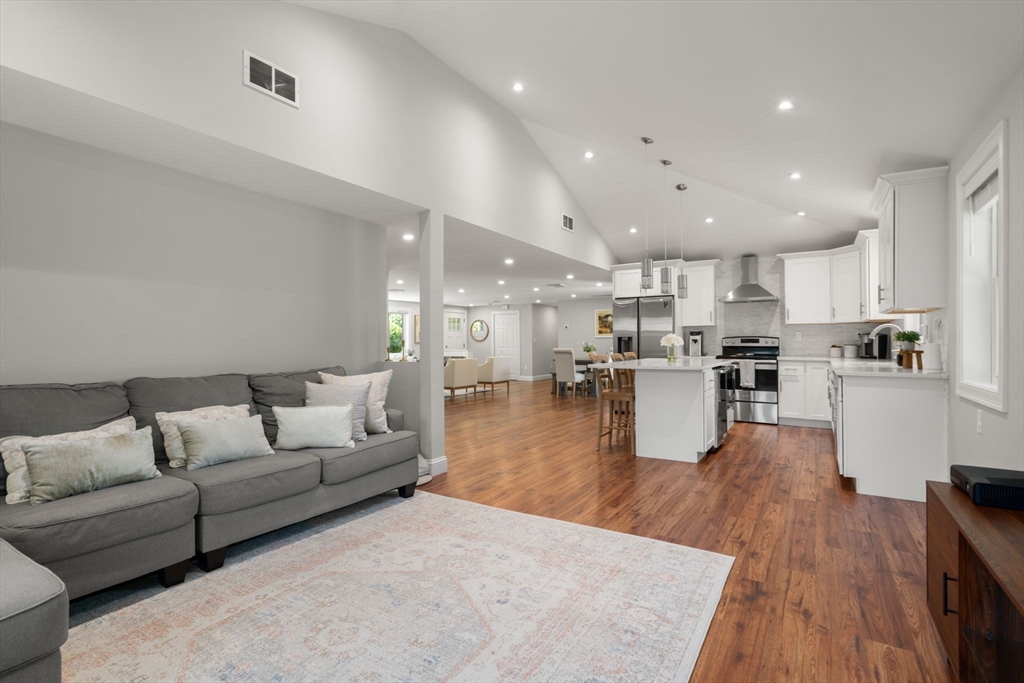 10 Brookdale Road Natick, MA 01760 - Photo 9 of 19 a living room with furniture and kitchen view with wooden floor