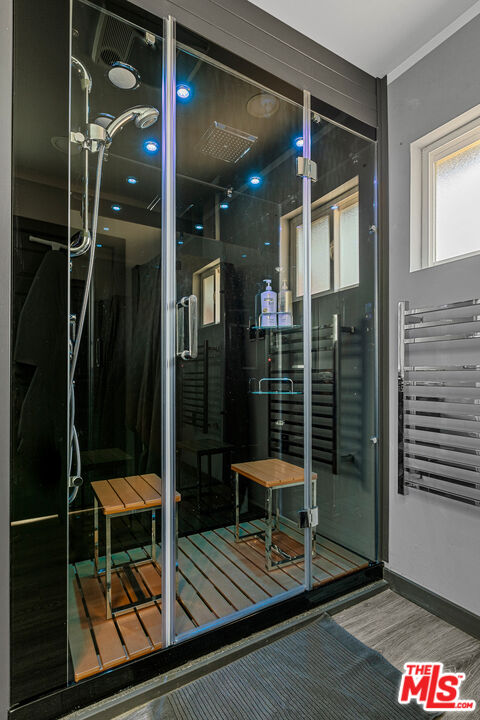 306 Victoria Lane Sugarloaf, CA 92386 - Photo 11 of 37 a bathroom with a glass door shower and a sink