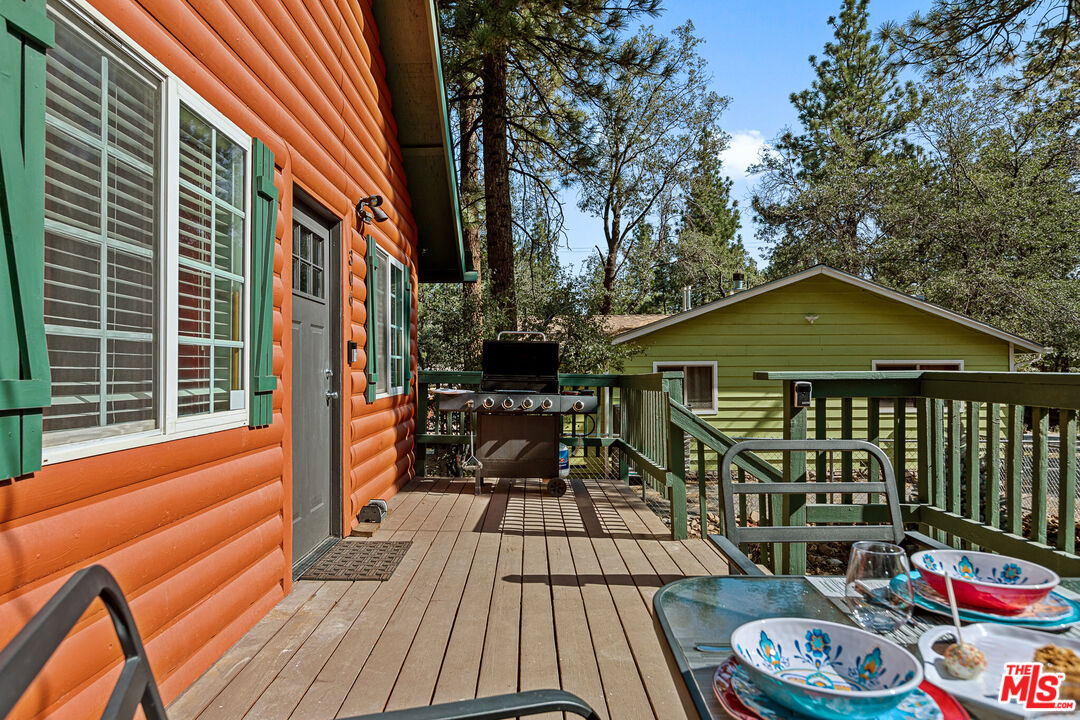 306 Victoria Lane Sugarloaf, CA 92386 - Photo 16 of 37 a view of a wooden chairs and table in the balcony