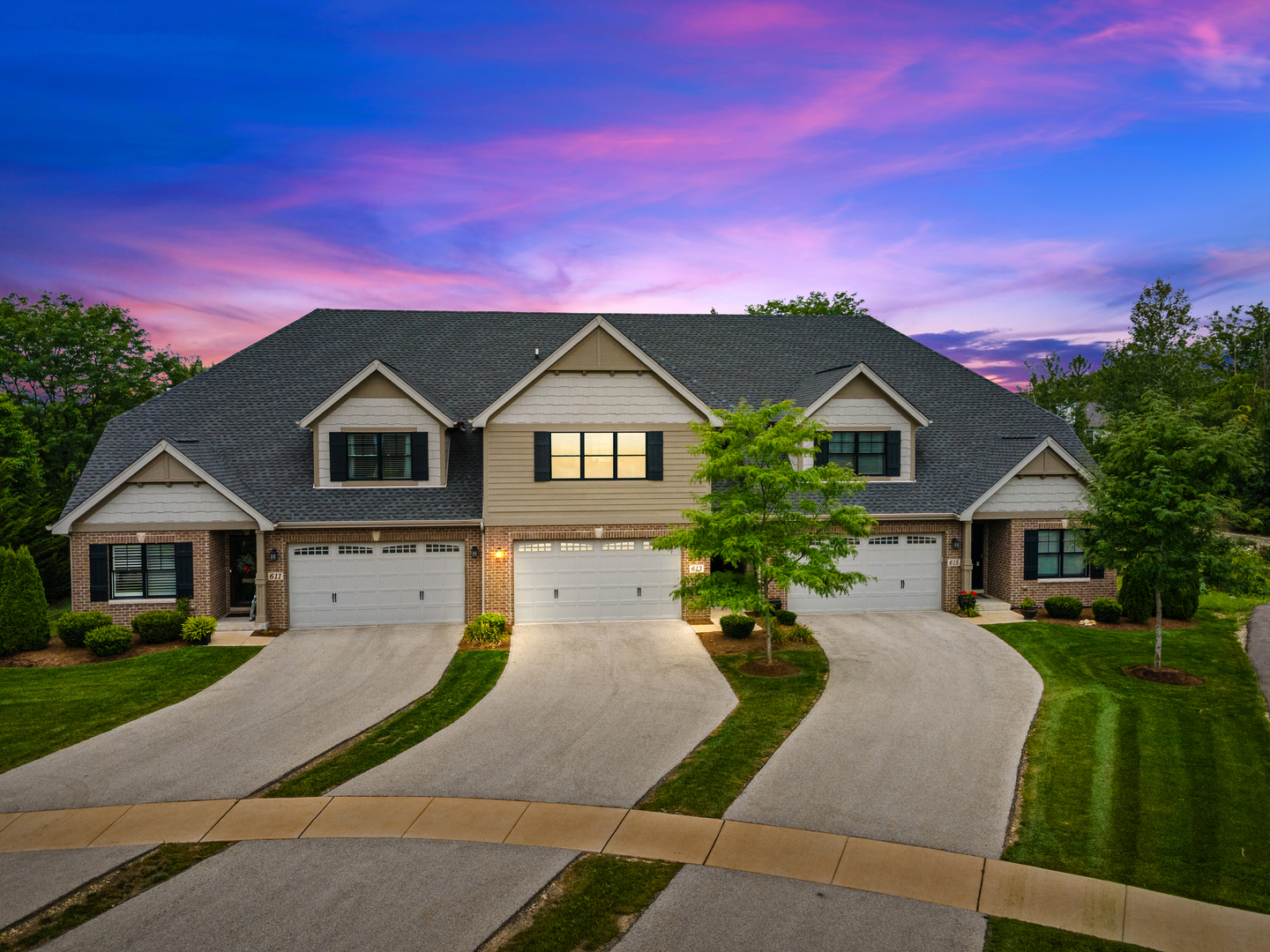 a front view of a house with a yard