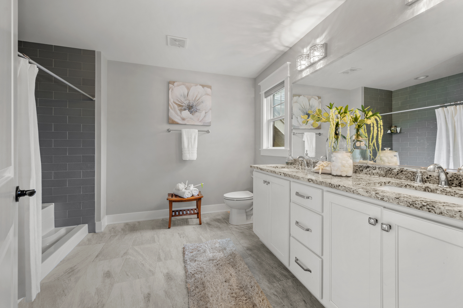 613 Bourbon Lane Naperville, IL 60565 - Photo 15 of 36 a spacious bathroom with a granite countertop sink a toilet and a mirror
