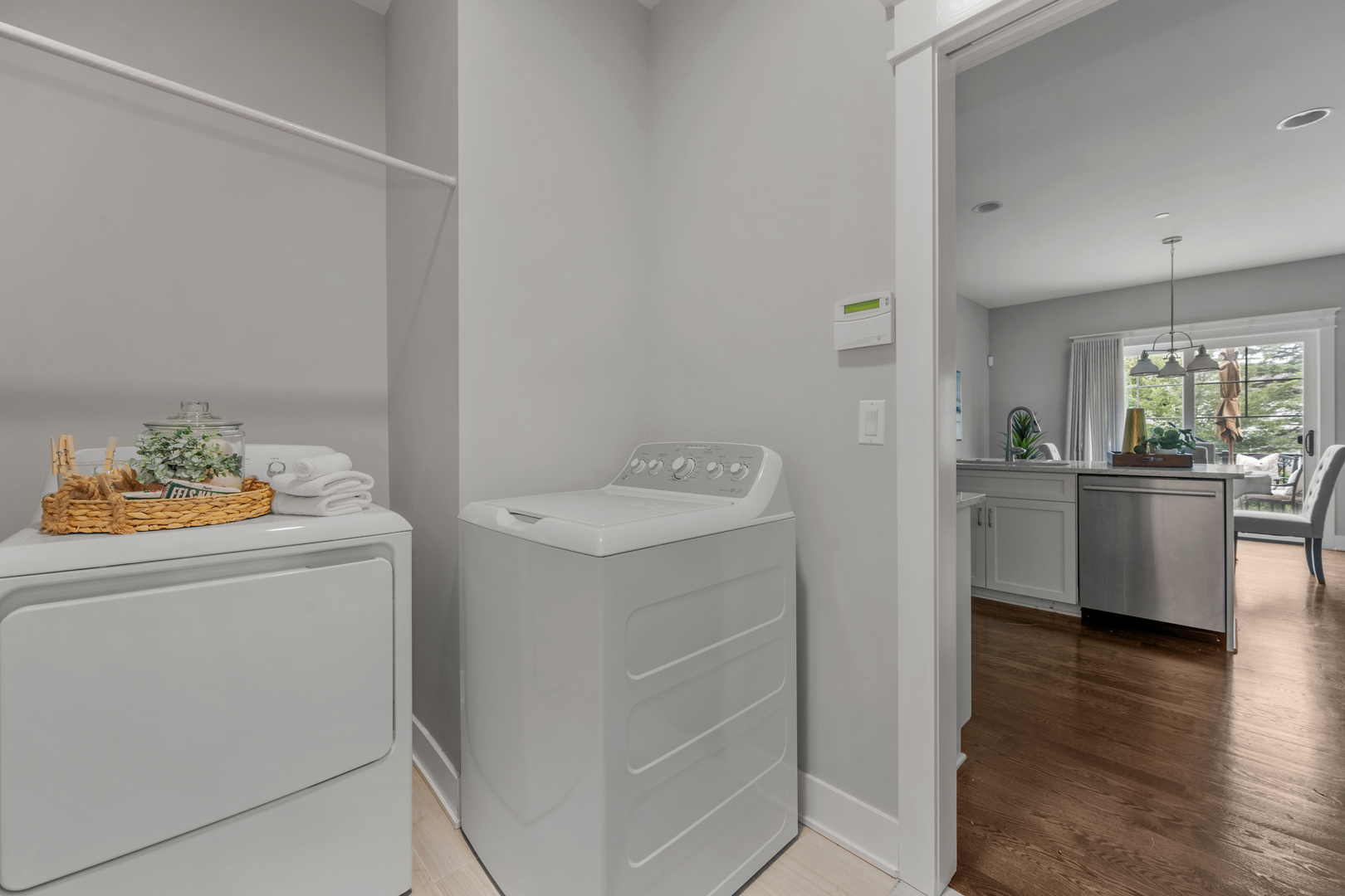 613 Bourbon Lane Naperville, IL 60565 - Photo 20 of 36 a kitchen with a sink cabinets and wooden floor