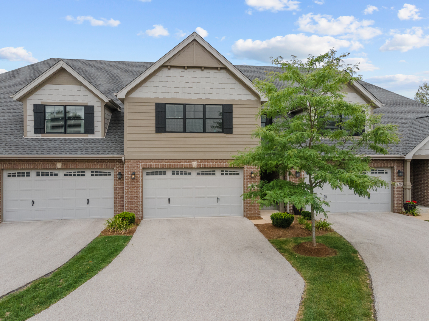 613 Bourbon Lane Naperville, IL 60565 - Photo 27 of 36 a view of a house with a yard and potted plants
