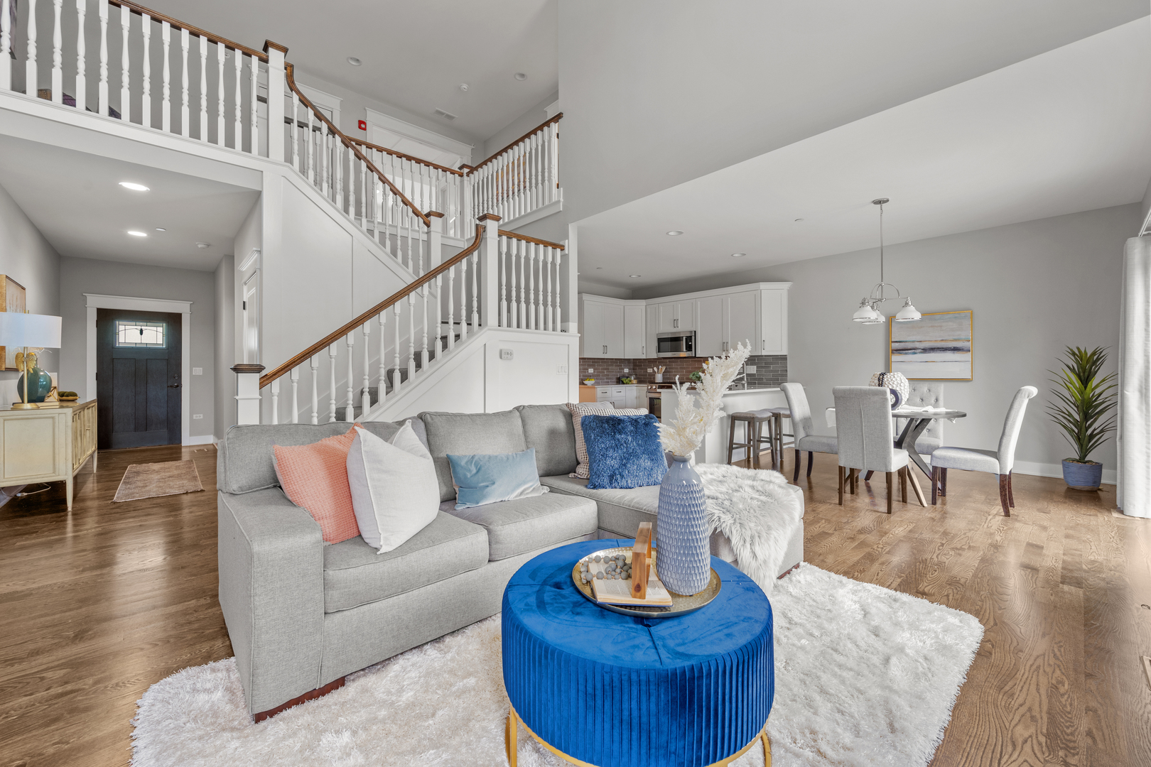 613 Bourbon Lane Naperville, IL 60565 - Photo 3 of 36 a living room with furniture and a dining table