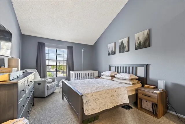 a bed room with a bed and a window