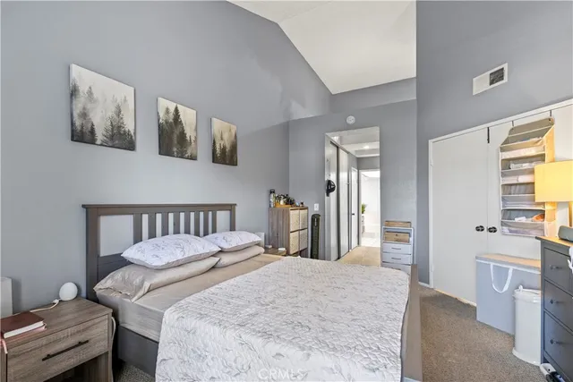 a bedroom with a bed and a couch