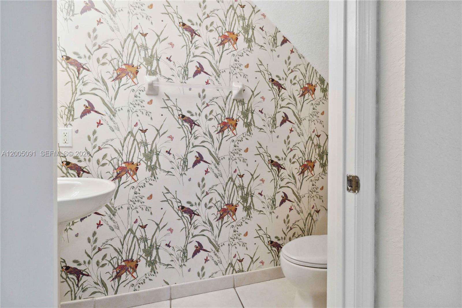 3079 Southwest 129th Way, Unit 159 Miramar, FL 33027 - Photo 15 of 44 a white toilet sitting next to a shower curtain