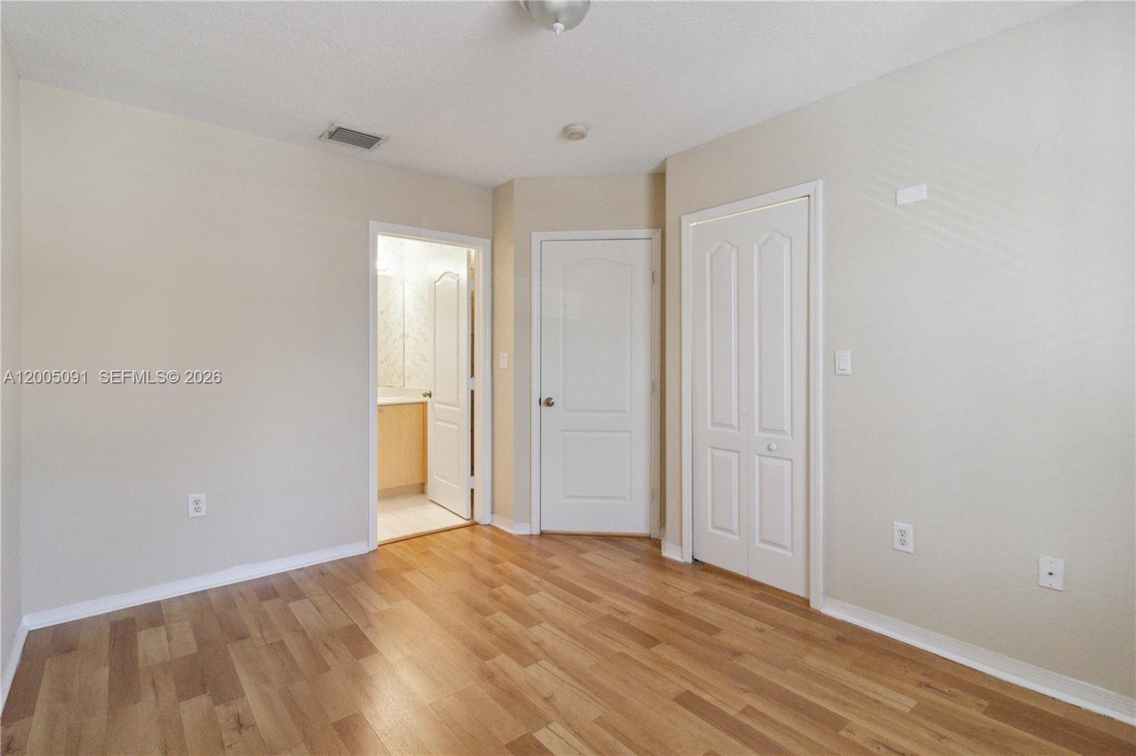 3079 Southwest 129th Way, Unit 159 Miramar, FL 33027 - Photo 19 of 44 a view of empty room with wooden floor