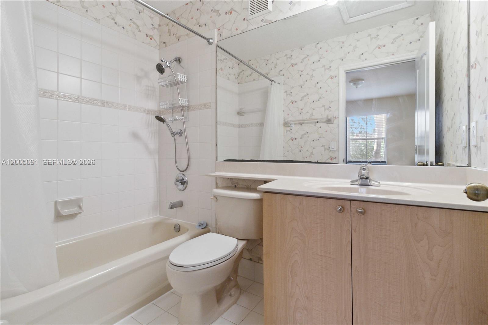 3079 Southwest 129th Way, Unit 159 Miramar, FL 33027 - Photo 26 of 44 a bathroom with a granite countertop sink a toilet and shower