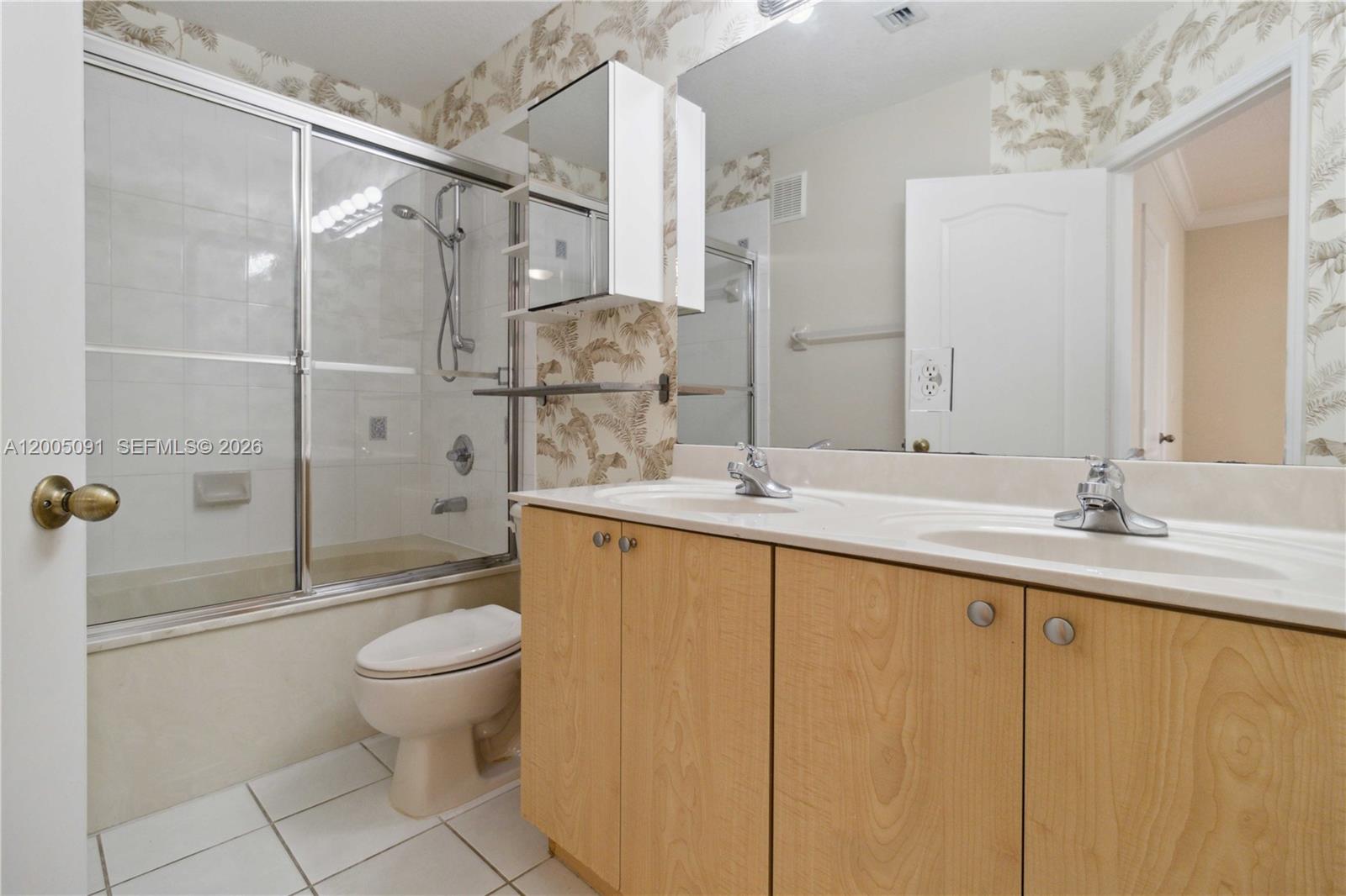 3079 Southwest 129th Way, Unit 159 Miramar, FL 33027 - Photo 27 of 44 a bathroom with a sink toilet and shower