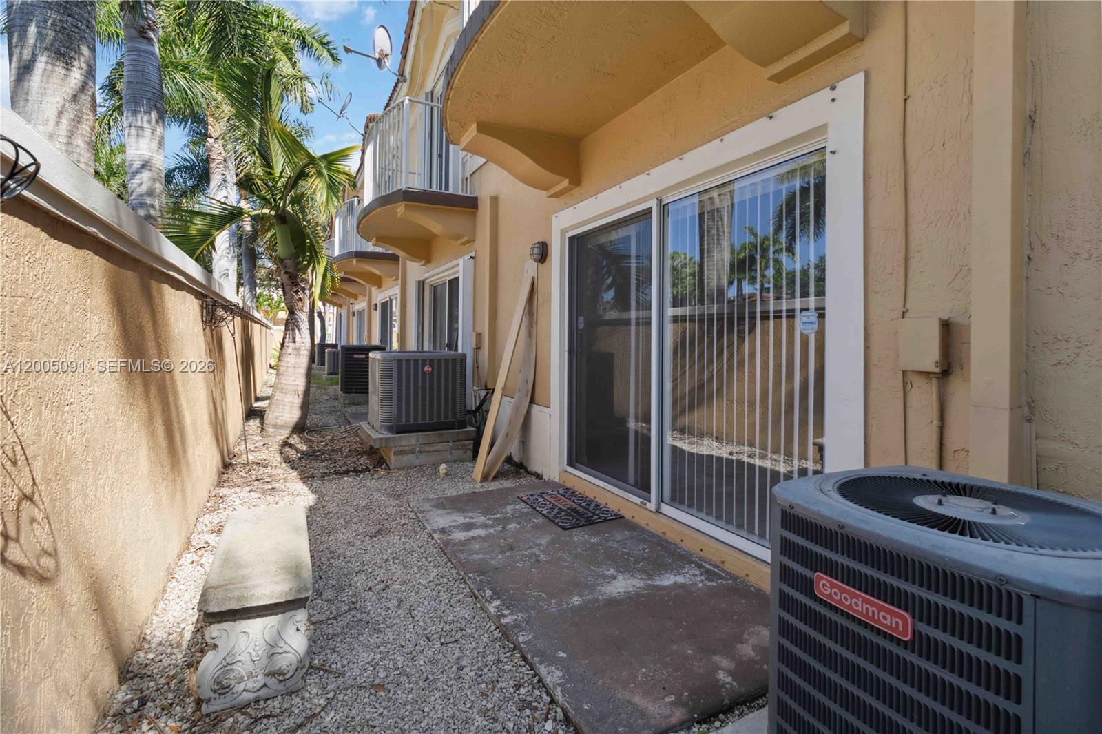 3079 Southwest 129th Way, Unit 159 Miramar, FL 33027 - Photo 31 of 44 a living room with a couch and a potted plant